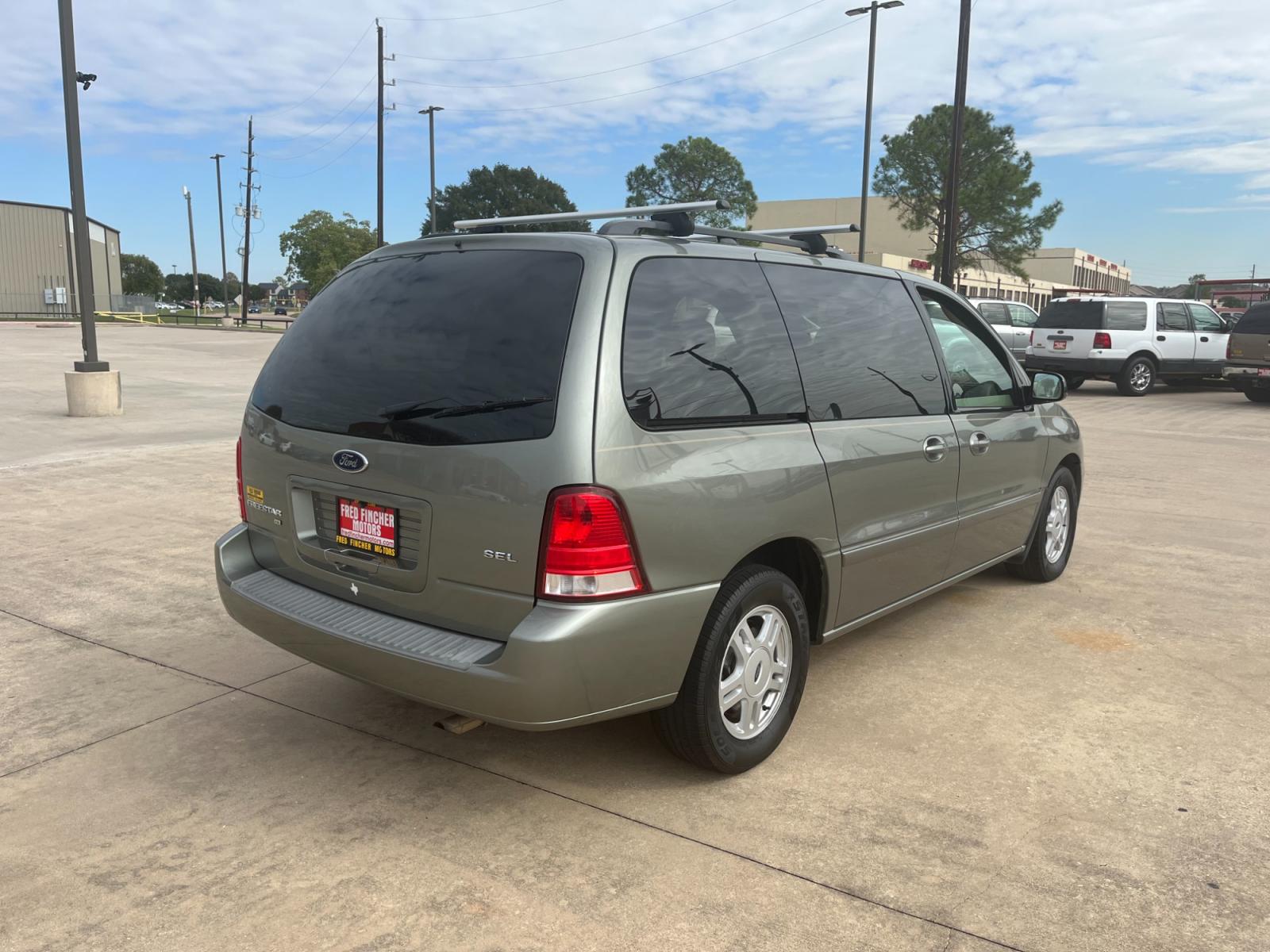 2004 green /TAN Ford Freestar SEL (2FMZA52264B) with an 4.2L V6 OHV 12V engine, 4-Speed Automatic Overdrive transmission, located at 14700 Tomball Parkway 249, Houston, TX, 77086, (281) 444-2200, 29.928619, -95.504074 - Photo #6