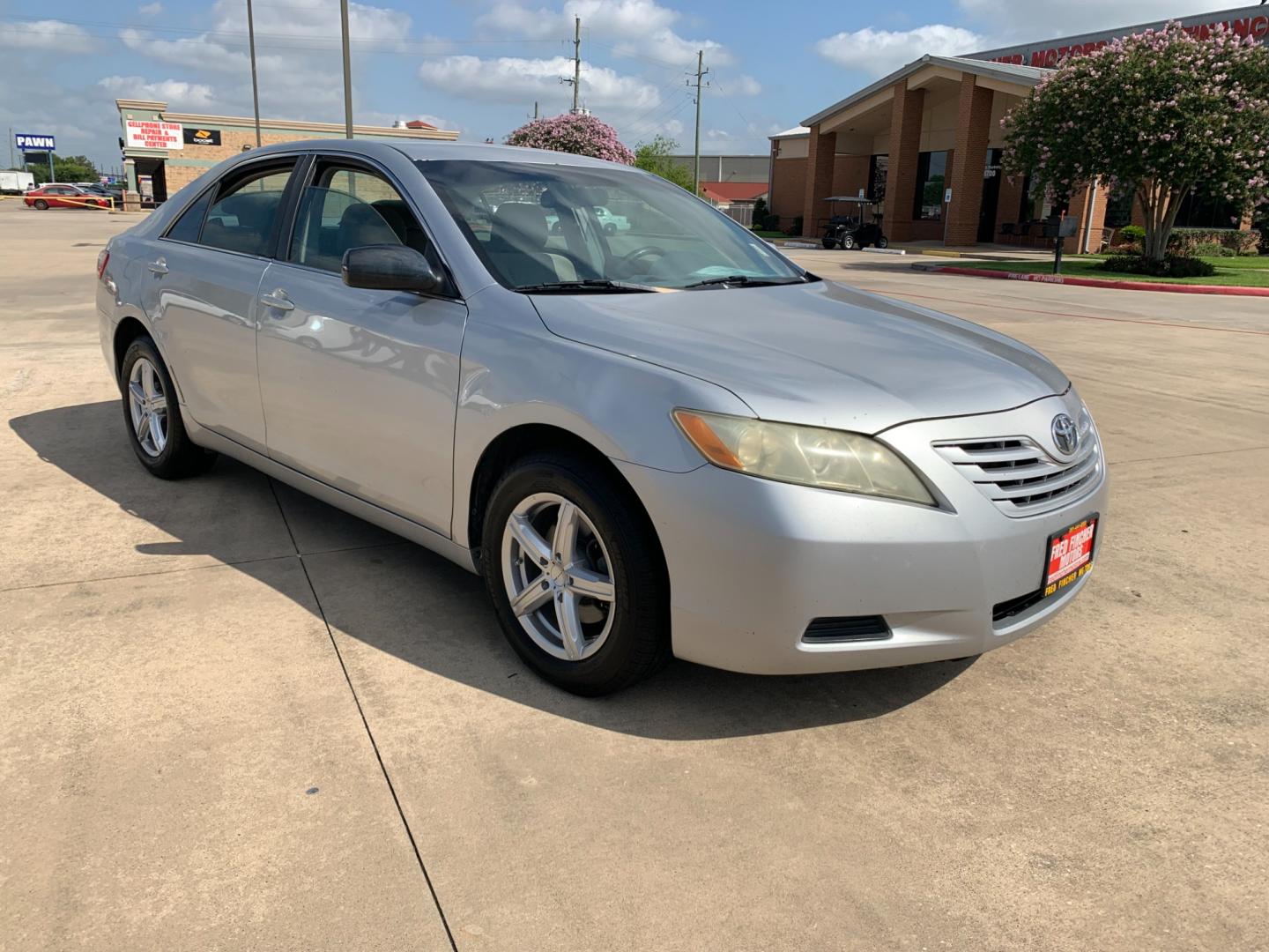 2009 silver Toyota Camry LE V6 6-Spd AT (4T1BK46K39U) with an 3.5L V6 DOHC 24V engine, 6-Speed Automatic Overdrive transmission, located at 14700 Tomball Parkway 249, Houston, TX, 77086, (281) 444-2200, 29.928619, -95.504074 - Photo#0