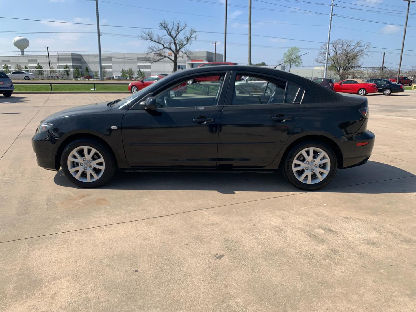 2008 Black /black Mazda MAZDA3 i Sport 4-Door (JM1BK32FX81) with an 2.0L L4 DOHC 16V engine, Automatic transmission, located at 14700 Tomball Parkway 249, Houston, TX, 77086, (281) 444-2200, 29.928619, -95.504074 - Photo#3