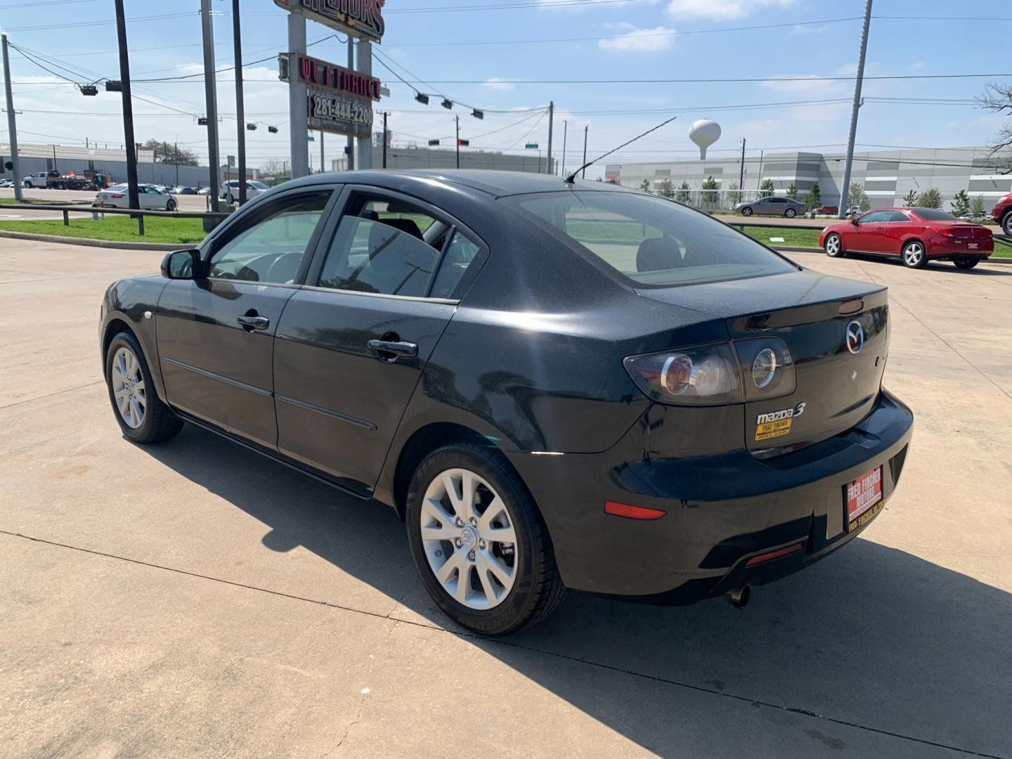 2008 Black /black Mazda MAZDA3 i Sport 4-Door (JM1BK32FX81) with an 2.0L L4 DOHC 16V engine, Automatic transmission, located at 14700 Tomball Parkway 249, Houston, TX, 77086, (281) 444-2200, 29.928619, -95.504074 - Photo#4