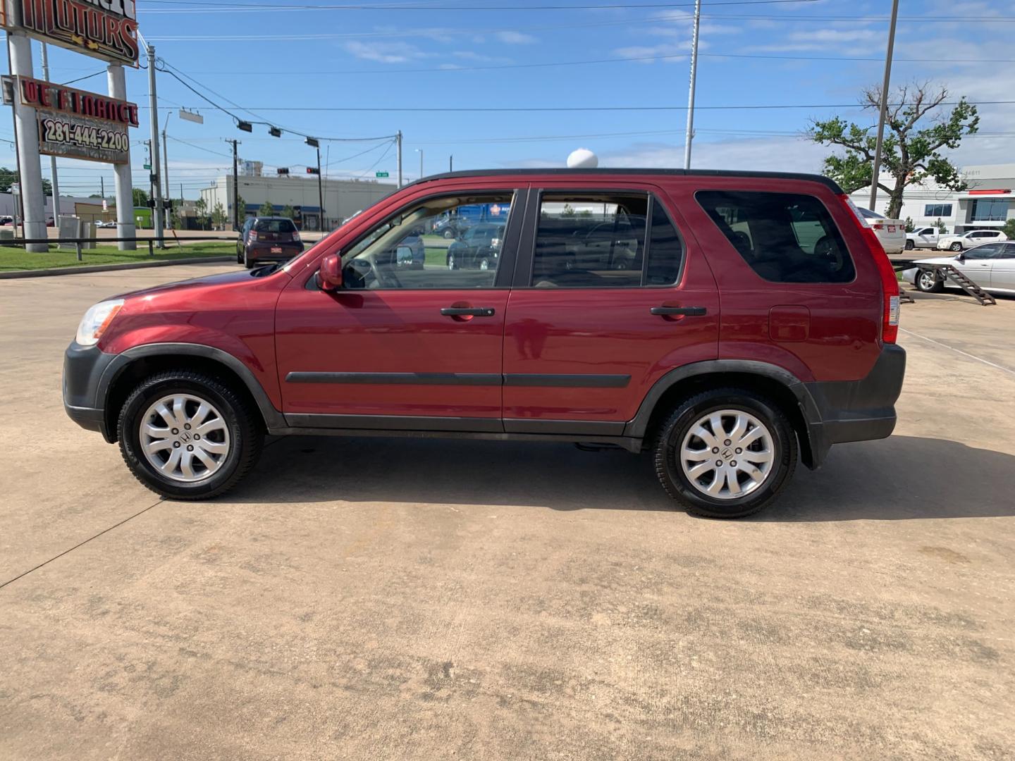 2005 red Honda CR-V EX 4WD AT (JHLRD78855C) with an 2.4L L4 DOHC 16V engine, 5-Speed Automatic Overdrive transmission, located at 14700 Tomball Parkway 249, Houston, TX, 77086, (281) 444-2200, 29.928619, -95.504074 - Photo#3