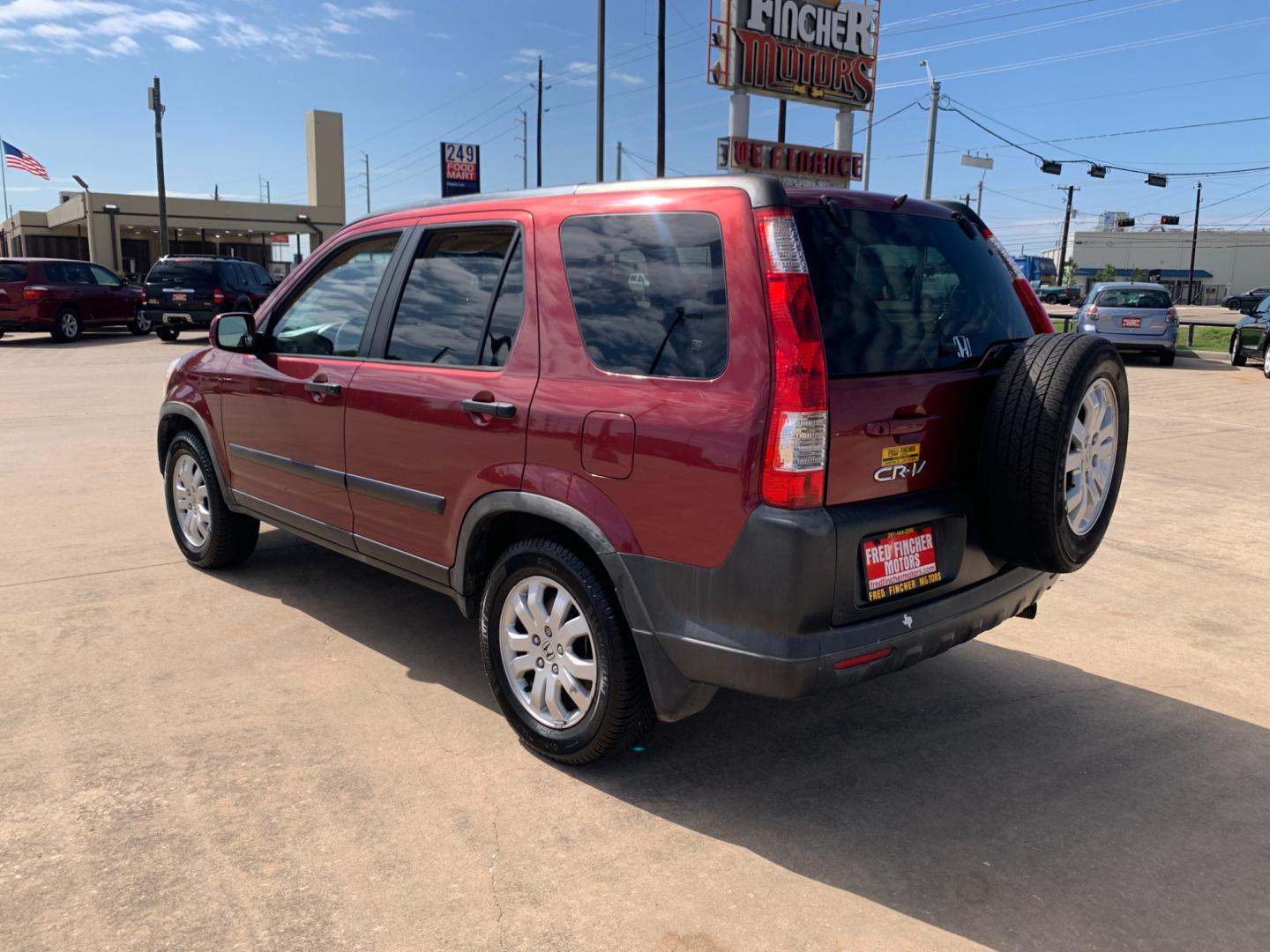 2005 red Honda CR-V EX 4WD AT (JHLRD78855C) with an 2.4L L4 DOHC 16V engine, 5-Speed Automatic Overdrive transmission, located at 14700 Tomball Parkway 249, Houston, TX, 77086, (281) 444-2200, 29.928619, -95.504074 - Photo#4