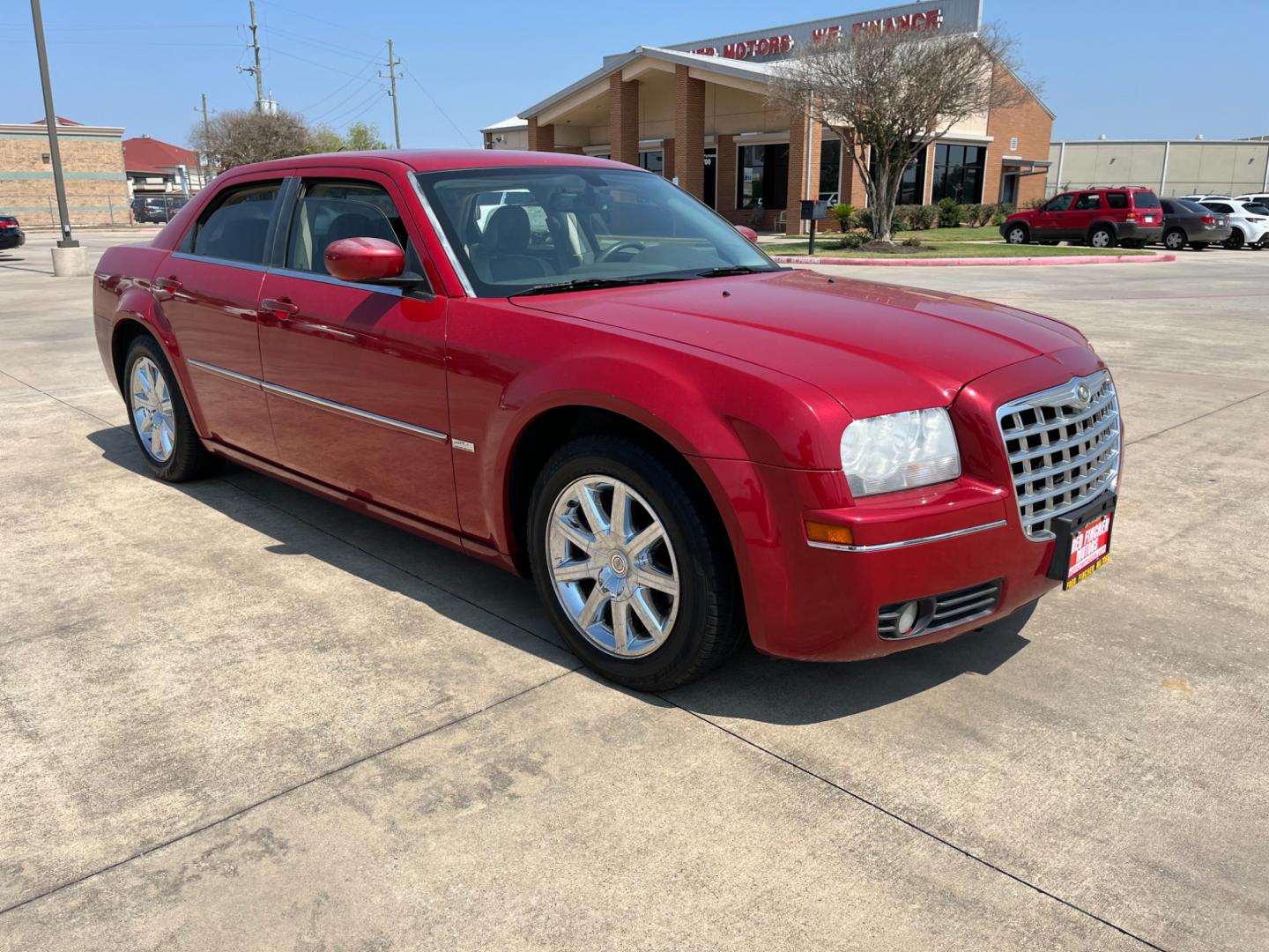 2008 red /TAN Chrysler 300 Touring (2C3LA53GX8H) with an 3.5L V6 DOHC 24V engine, 4-Speed Automatic Overdrive transmission, located at 14700 Tomball Parkway 249, Houston, TX, 77086, (281) 444-2200, 29.928619, -95.504074 - Photo#0