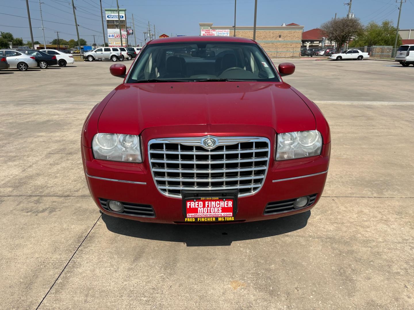 2008 red /TAN Chrysler 300 Touring (2C3LA53GX8H) with an 3.5L V6 DOHC 24V engine, 4-Speed Automatic Overdrive transmission, located at 14700 Tomball Parkway 249, Houston, TX, 77086, (281) 444-2200, 29.928619, -95.504074 - Photo#1