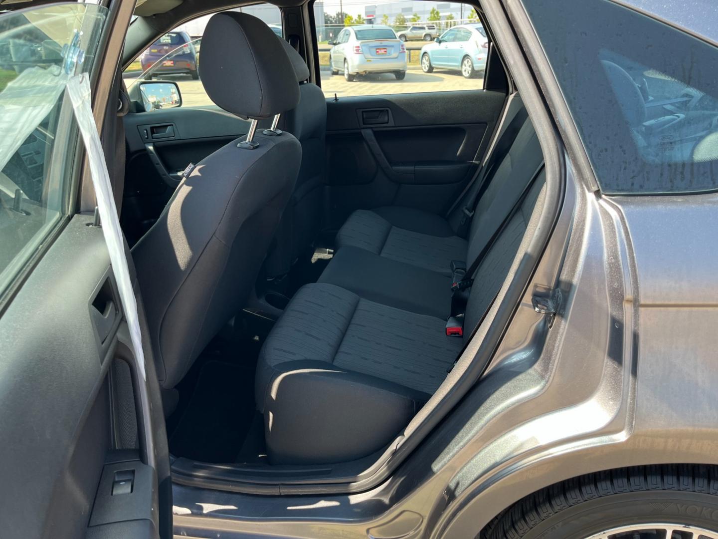 2010 /black Ford Focus SE Sedan (1FAHP3FN5AW) with an 2.0L L4 DOHC 16V engine, Automatic transmission, located at 14700 Tomball Parkway 249, Houston, TX, 77086, (281) 444-2200, 29.928619, -95.504074 - Photo#9