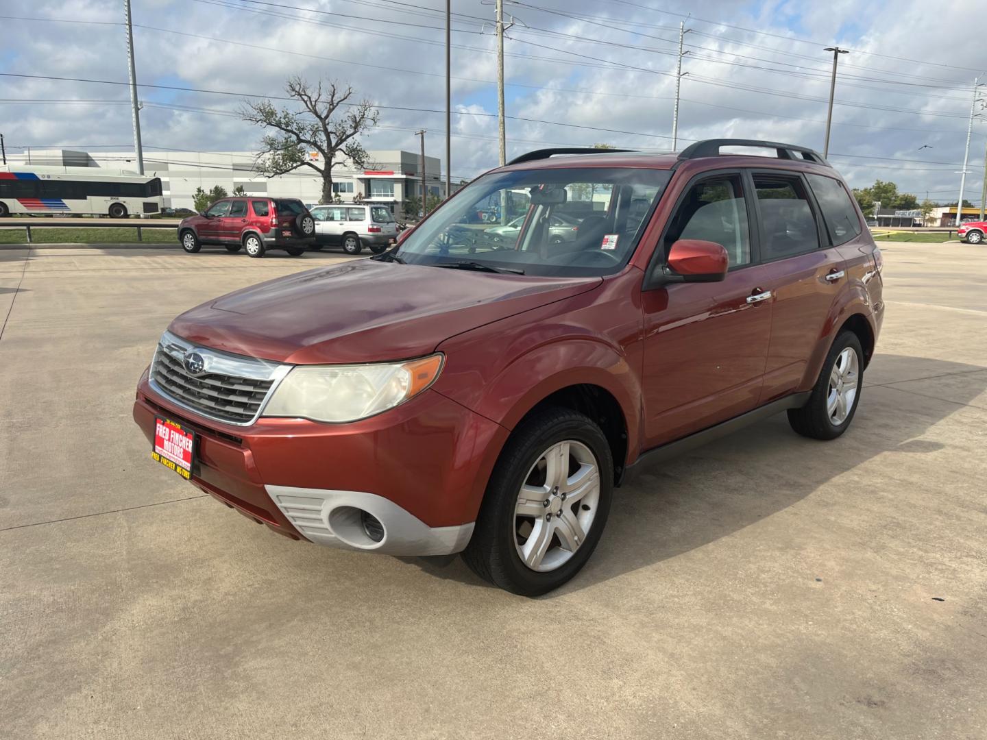 2010 orange /black Subaru Forester 2.5X Premium (JF2SH6CCXAH) with an 2.5L H4 SOHC 16V engine, 4-Speed Automatic transmission, located at 14700 Tomball Parkway 249, Houston, TX, 77086, (281) 444-2200, 29.928619, -95.504074 - Photo#2