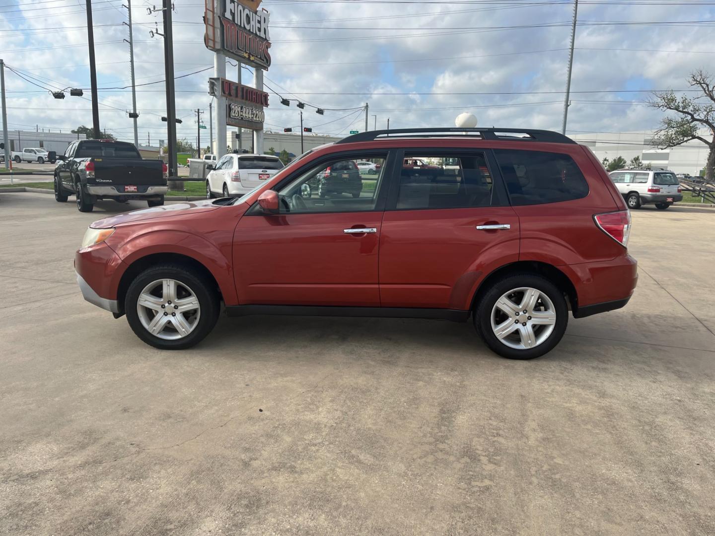 2010 orange /black Subaru Forester 2.5X Premium (JF2SH6CCXAH) with an 2.5L H4 SOHC 16V engine, 4-Speed Automatic transmission, located at 14700 Tomball Parkway 249, Houston, TX, 77086, (281) 444-2200, 29.928619, -95.504074 - Photo#3