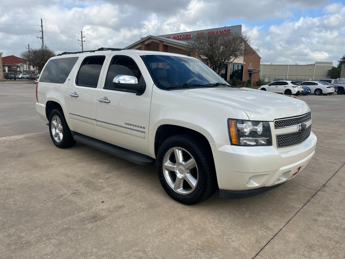 2011 white /tan Chevrolet Suburban LTZ 1500 2WD (1GNSCKE06BR) with an 5.3L V8 OHV 16V FFV engine, 4-Speed Automatic transmission, located at 14700 Tomball Parkway 249, Houston, TX, 77086, (281) 444-2200, 29.928619, -95.504074 - Photo#0