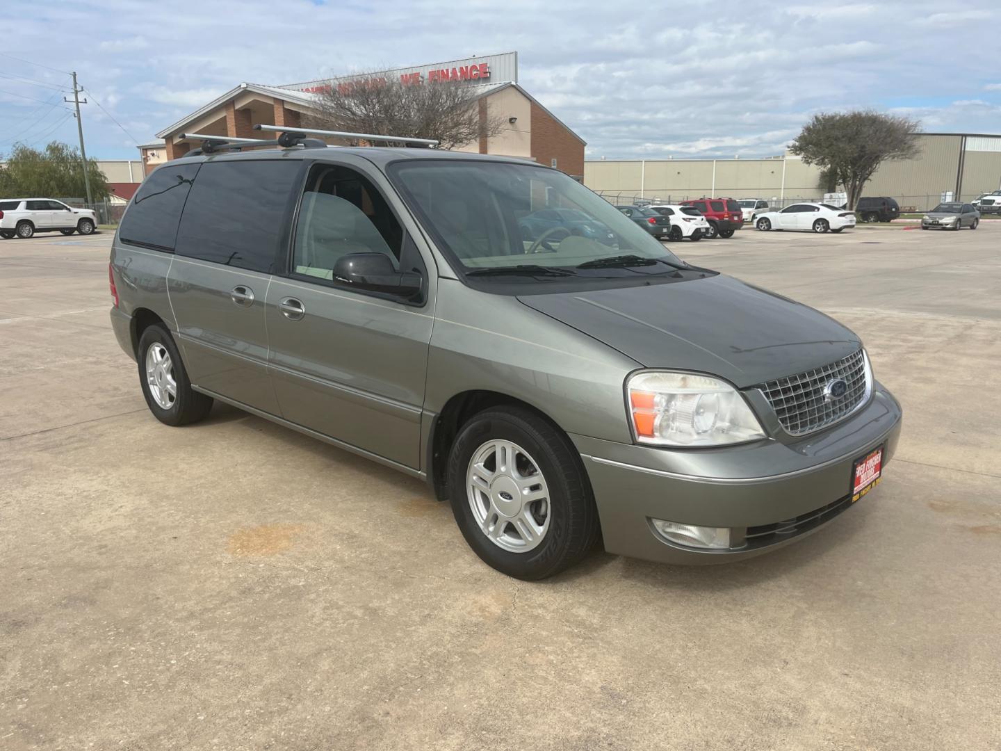 2004 green /TAN Ford Freestar SEL (2FMZA52264B) with an 4.2L V6 OHV 12V engine, 4-Speed Automatic Overdrive transmission, located at 14700 Tomball Parkway 249, Houston, TX, 77086, (281) 444-2200, 29.928619, -95.504074 - Photo#0