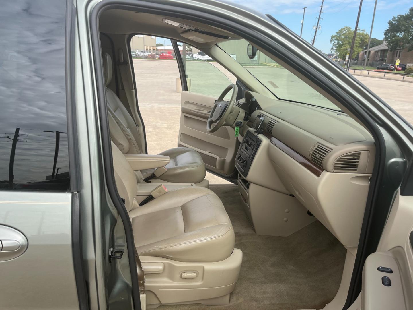 2004 green /TAN Ford Freestar SEL (2FMZA52264B) with an 4.2L V6 OHV 12V engine, 4-Speed Automatic Overdrive transmission, located at 14700 Tomball Parkway 249, Houston, TX, 77086, (281) 444-2200, 29.928619, -95.504074 - Photo#9