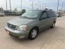 2004 green /TAN Ford Freestar SEL (2FMZA52264B) with an 4.2L V6 OHV 12V engine, 4-Speed Automatic Overdrive transmission, located at 14700 Tomball Parkway 249, Houston, TX, 77086, (281) 444-2200, 29.928619, -95.504074 - Photo#2