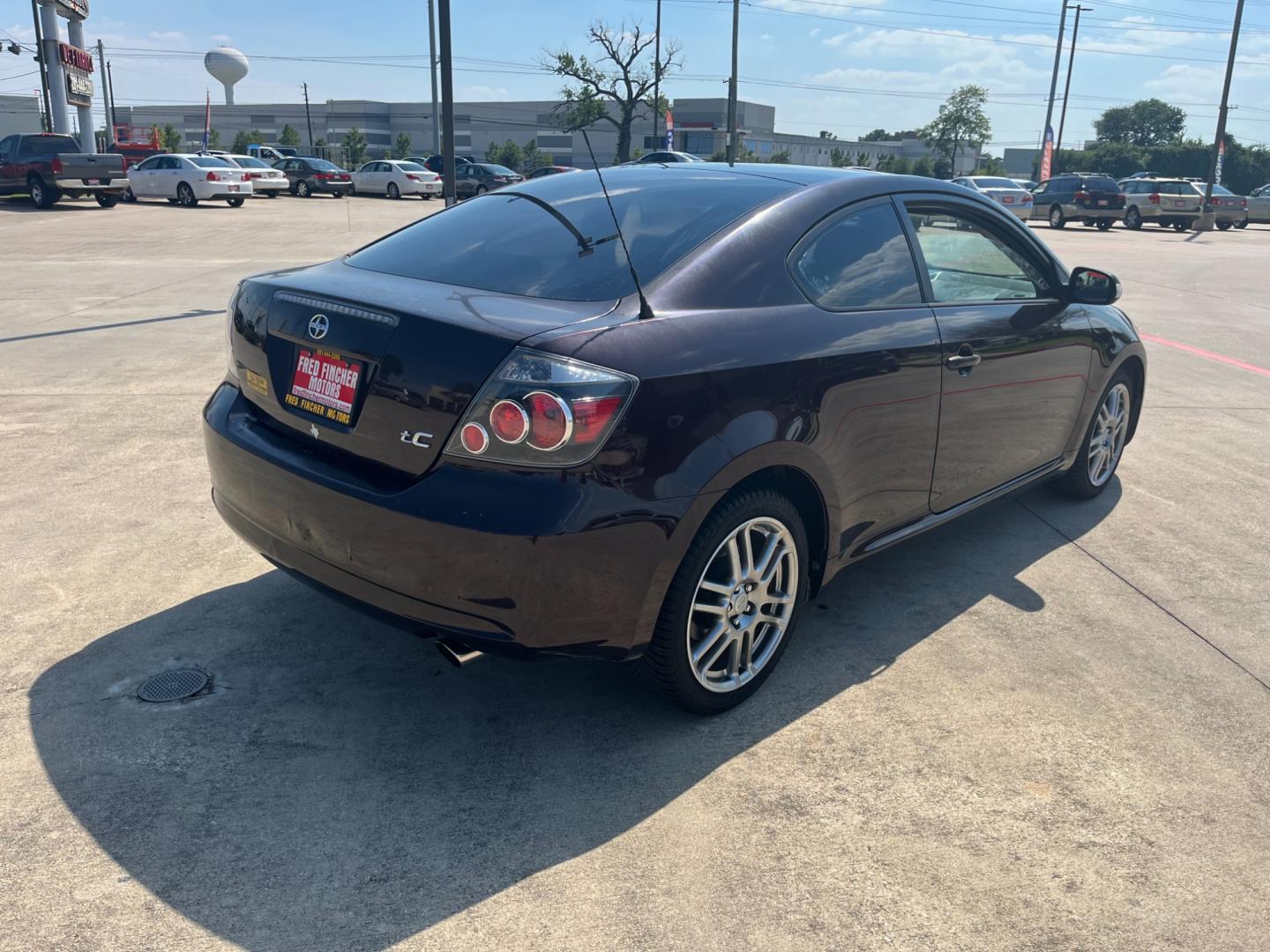 2008 purple /black Scion tC Sport Coupe (JTKDE167980) with an 2.4L L4 DOHC 16V engine, Automatic transmission, located at 14700 Tomball Parkway 249, Houston, TX, 77086, (281) 444-2200, 29.928619, -95.504074 - Photo#6