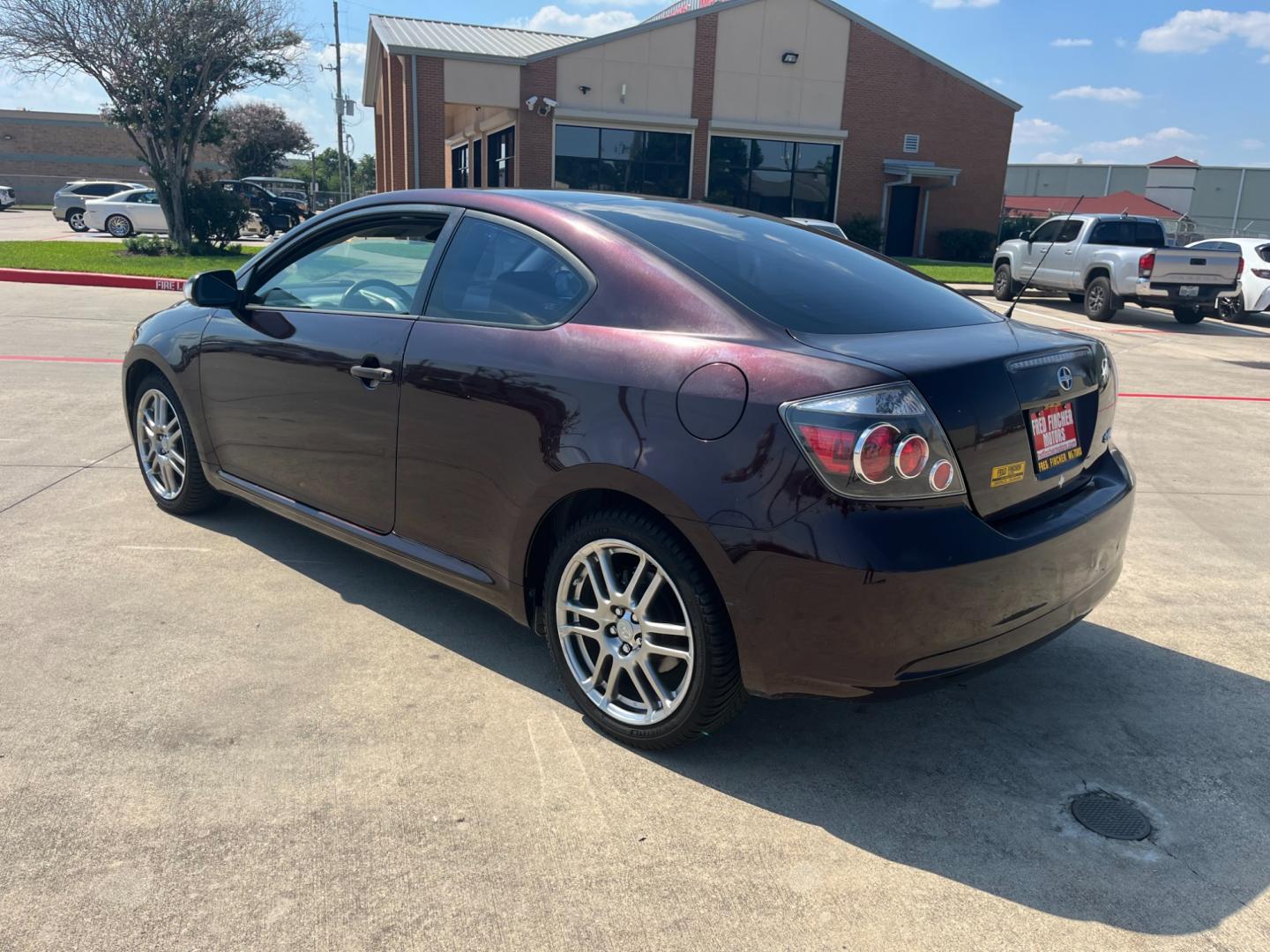 2008 purple /black Scion tC Sport Coupe (JTKDE167980) with an 2.4L L4 DOHC 16V engine, Automatic transmission, located at 14700 Tomball Parkway 249, Houston, TX, 77086, (281) 444-2200, 29.928619, -95.504074 - Photo#4