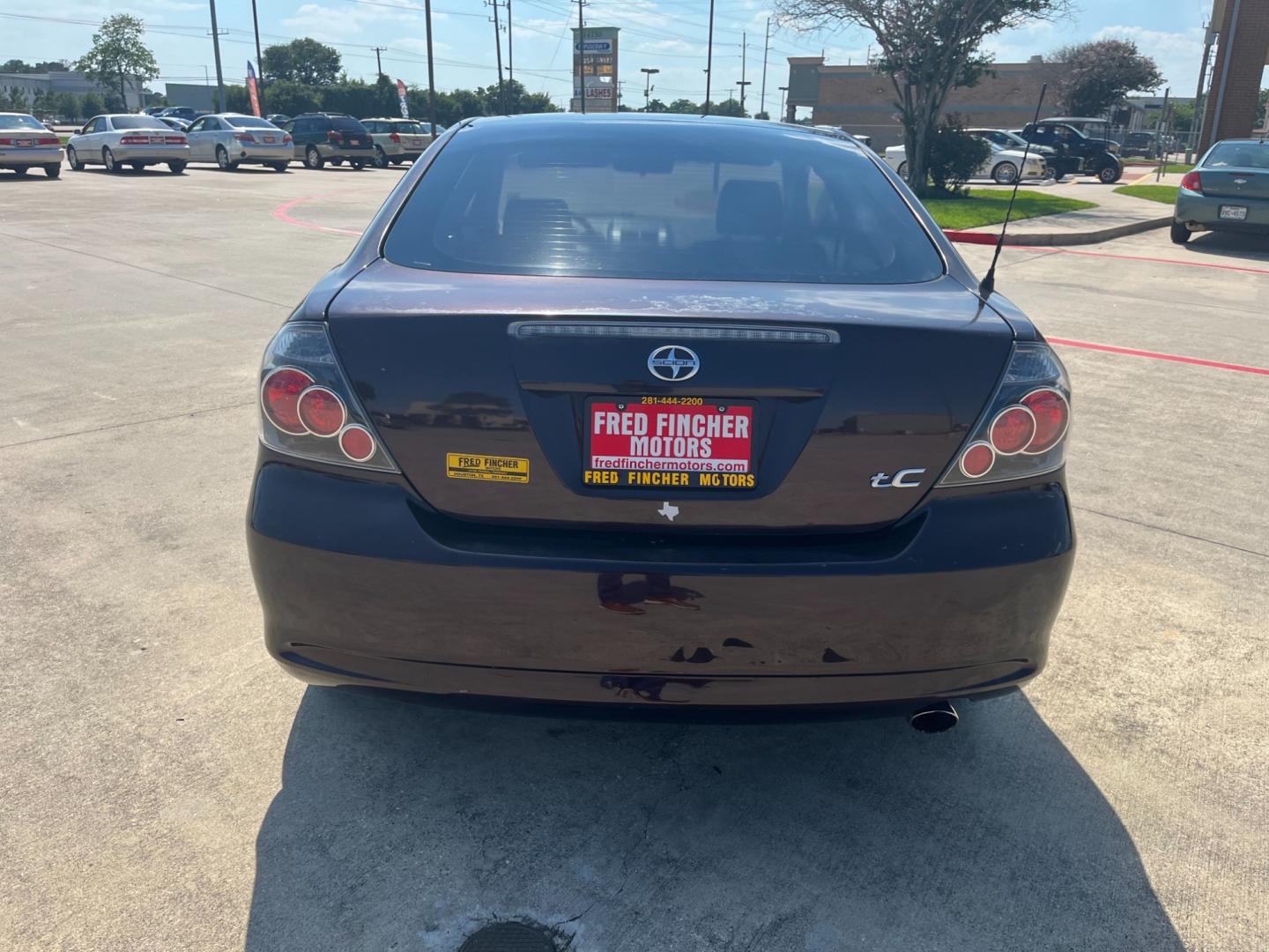 2008 purple /black Scion tC Sport Coupe (JTKDE167980) with an 2.4L L4 DOHC 16V engine, Automatic transmission, located at 14700 Tomball Parkway 249, Houston, TX, 77086, (281) 444-2200, 29.928619, -95.504074 - Photo#5