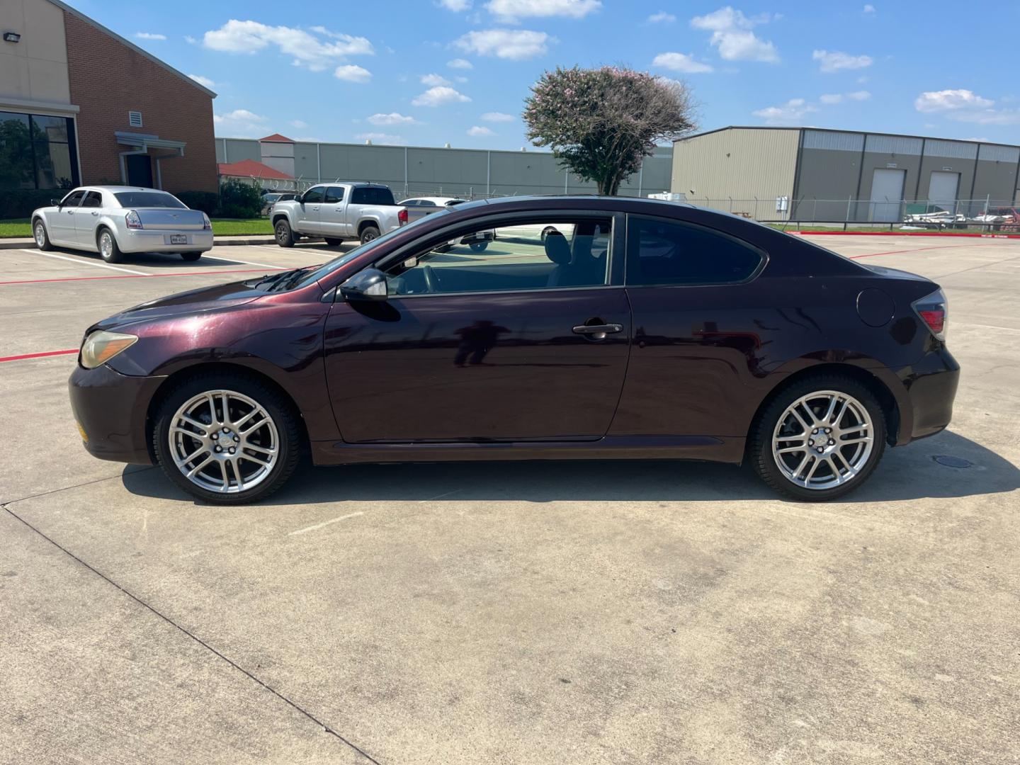 2008 purple /black Scion tC Sport Coupe (JTKDE167980) with an 2.4L L4 DOHC 16V engine, Automatic transmission, located at 14700 Tomball Parkway 249, Houston, TX, 77086, (281) 444-2200, 29.928619, -95.504074 - Photo#3