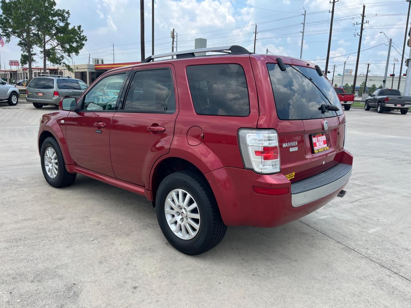 2009 red Mercury Mariner Premier V6 2WD (4M2CU87G39K) , 6-Speed Automatic transmission, located at 14700 Tomball Parkway 249, Houston, TX, 77086, (281) 444-2200, 29.928619, -95.504074 - Photo#4