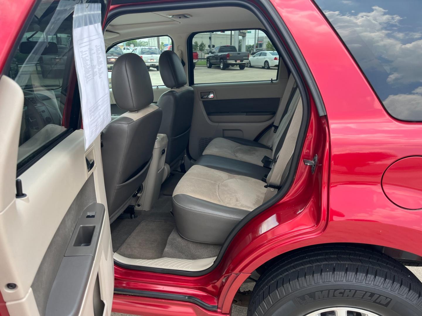 2009 red Mercury Mariner Premier V6 2WD (4M2CU87G39K) , 6-Speed Automatic transmission, located at 14700 Tomball Parkway 249, Houston, TX, 77086, (281) 444-2200, 29.928619, -95.504074 - Photo#9