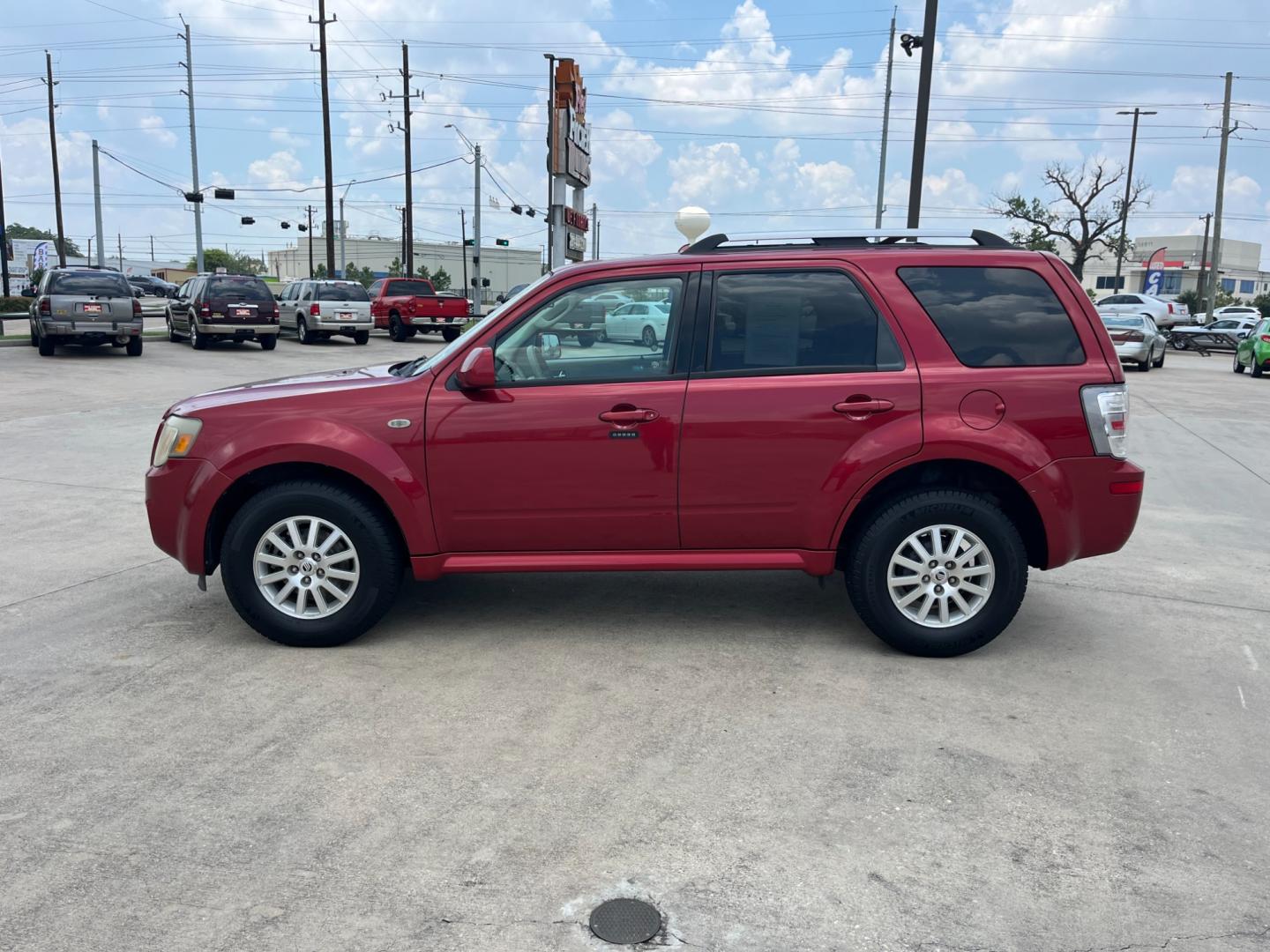 2009 red Mercury Mariner Premier V6 2WD (4M2CU87G39K) , 6-Speed Automatic transmission, located at 14700 Tomball Parkway 249, Houston, TX, 77086, (281) 444-2200, 29.928619, -95.504074 - Photo#3