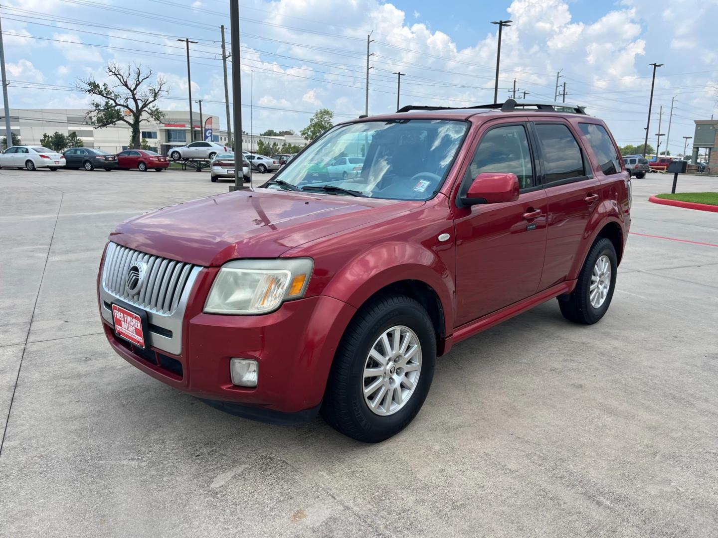 2009 red Mercury Mariner Premier V6 2WD (4M2CU87G39K) , 6-Speed Automatic transmission, located at 14700 Tomball Parkway 249, Houston, TX, 77086, (281) 444-2200, 29.928619, -95.504074 - Photo#2