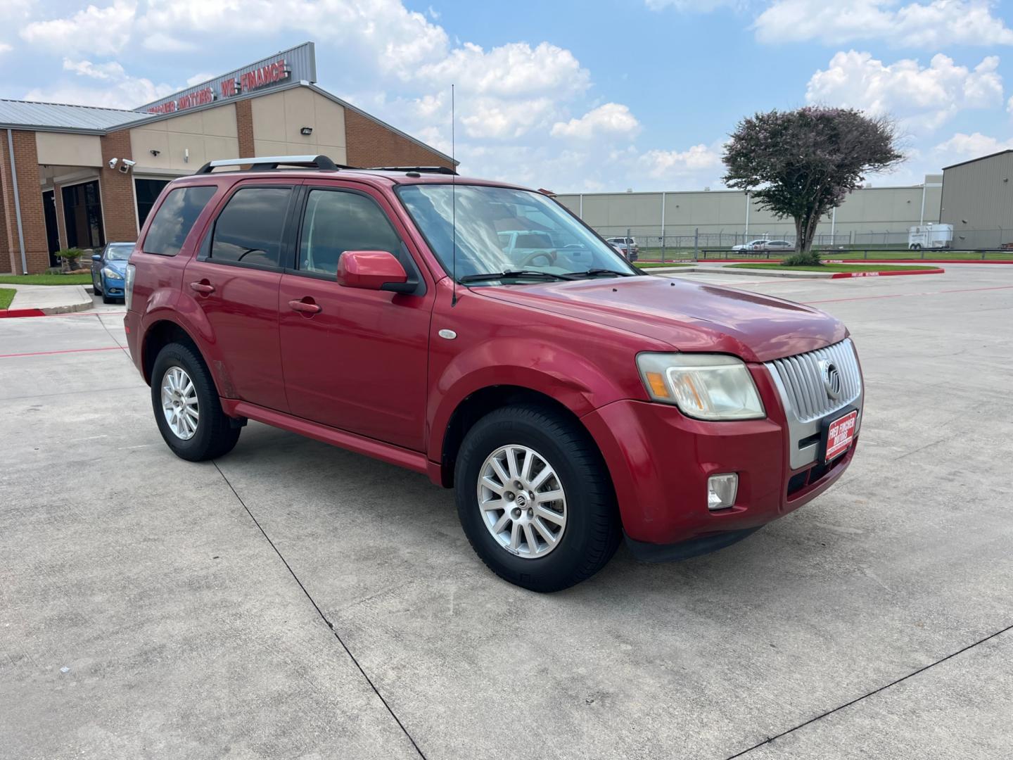 2009 red Mercury Mariner Premier V6 2WD (4M2CU87G39K) , 6-Speed Automatic transmission, located at 14700 Tomball Parkway 249, Houston, TX, 77086, (281) 444-2200, 29.928619, -95.504074 - Photo#0