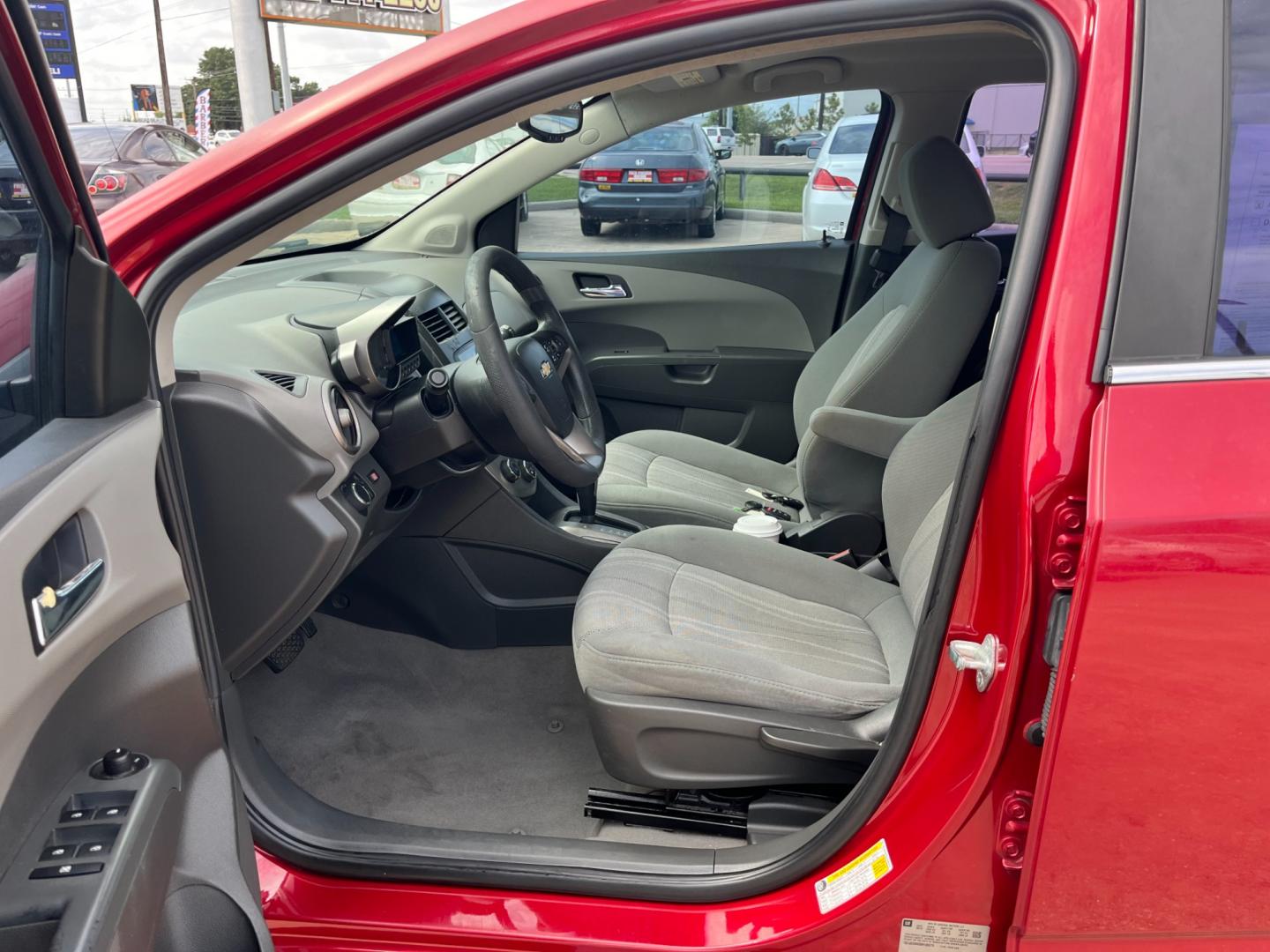 2013 red /black Chevrolet Sonic LT Auto 5-Door (1G1JC6SH3D4) with an 1.8L L4 DOHC 24V FFV engine, 6-Speed Automatic transmission, located at 14700 Tomball Parkway 249, Houston, TX, 77086, (281) 444-2200, 29.928619, -95.504074 - Photo#8