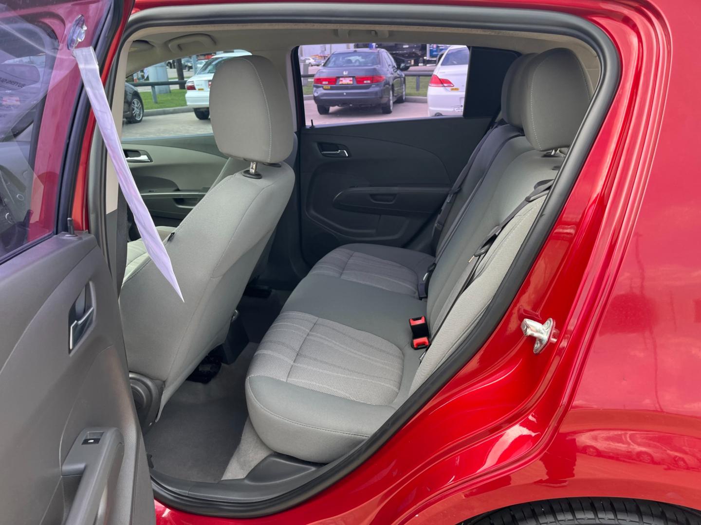 2013 red /black Chevrolet Sonic LT Auto 5-Door (1G1JC6SH3D4) with an 1.8L L4 DOHC 24V FFV engine, 6-Speed Automatic transmission, located at 14700 Tomball Parkway 249, Houston, TX, 77086, (281) 444-2200, 29.928619, -95.504074 - Photo#9