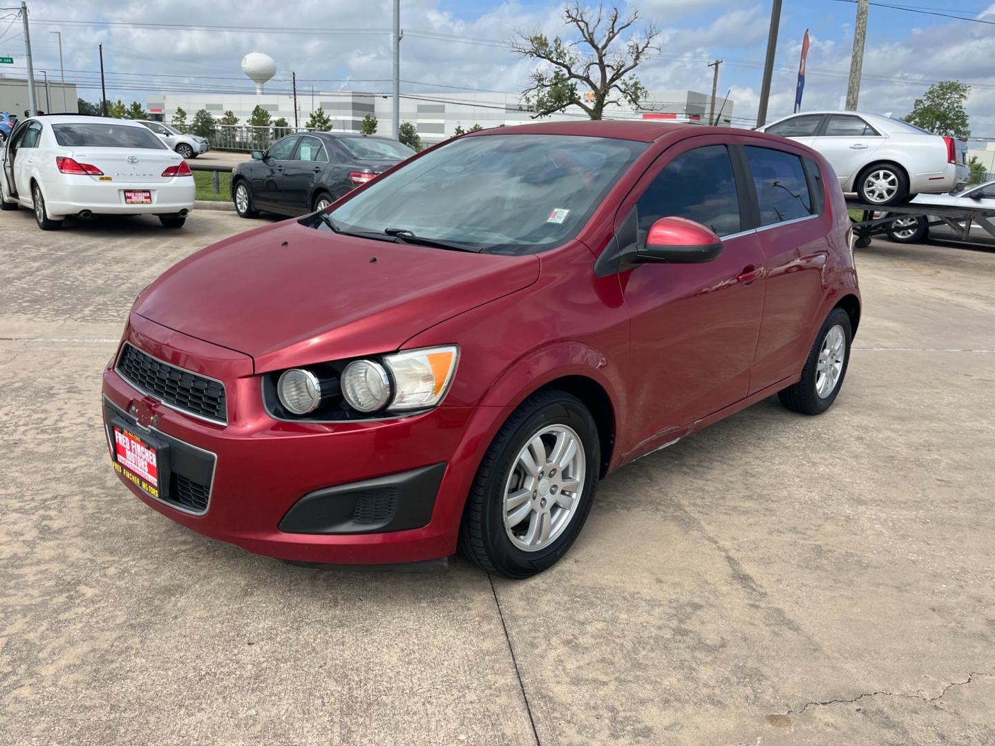 2013 red /black Chevrolet Sonic LT Auto 5-Door (1G1JC6SH3D4) with an 1.8L L4 DOHC 24V FFV engine, 6-Speed Automatic transmission, located at 14700 Tomball Parkway 249, Houston, TX, 77086, (281) 444-2200, 29.928619, -95.504074 - Photo#2