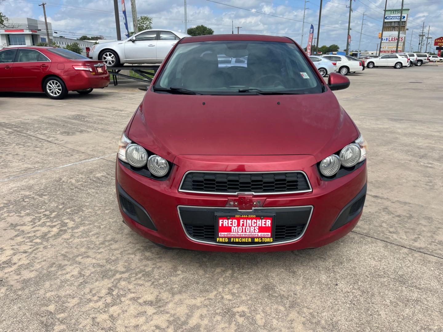 2013 red /black Chevrolet Sonic LT Auto 5-Door (1G1JC6SH3D4) with an 1.8L L4 DOHC 24V FFV engine, 6-Speed Automatic transmission, located at 14700 Tomball Parkway 249, Houston, TX, 77086, (281) 444-2200, 29.928619, -95.504074 - Photo#1