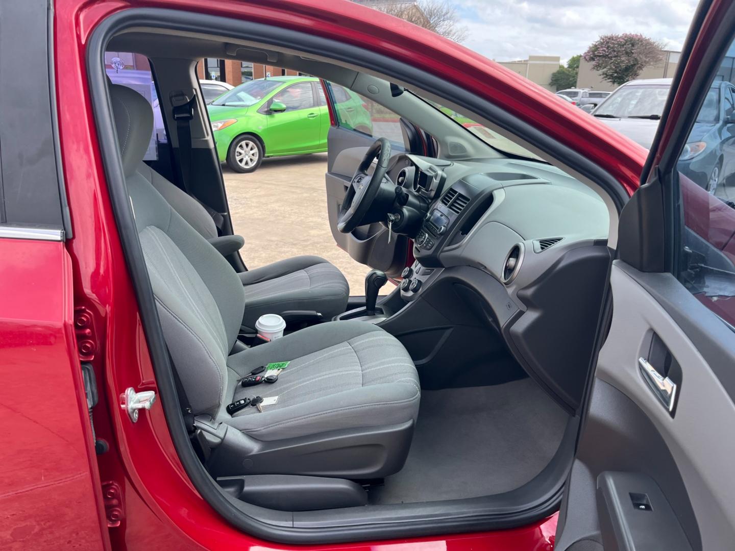 2013 red /black Chevrolet Sonic LT Auto 5-Door (1G1JC6SH3D4) with an 1.8L L4 DOHC 24V FFV engine, 6-Speed Automatic transmission, located at 14700 Tomball Parkway 249, Houston, TX, 77086, (281) 444-2200, 29.928619, -95.504074 - Photo#11