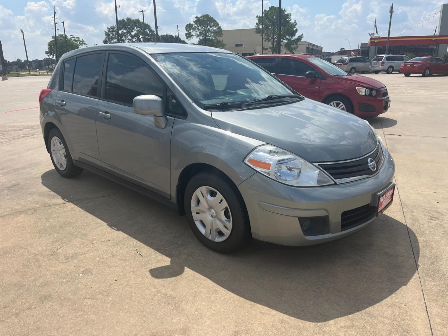 2012 GRAY /black Nissan Versa 1.8 SL Hatchback (3N1BC1CP6CK) with an 1.8L L4 DOHC 16V engine, Continuously Variable Transmission transmission, located at 14700 Tomball Parkway 249, Houston, TX, 77086, (281) 444-2200, 29.928619, -95.504074 - Photo#0