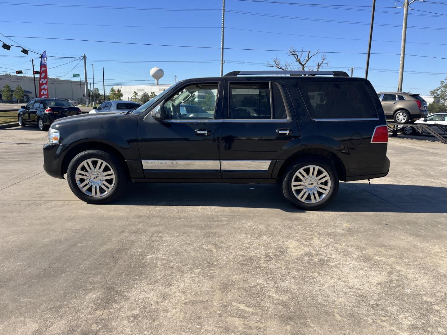 2012 black /TAN Lincoln Navigator 2WD (5LMJJ2H52CE) with an 5.4L V8 SOHC 24V engine, 6-Speed Automatic transmission, located at 14700 Tomball Parkway 249, Houston, TX, 77086, (281) 444-2200, 29.928619, -95.504074 - Photo#3