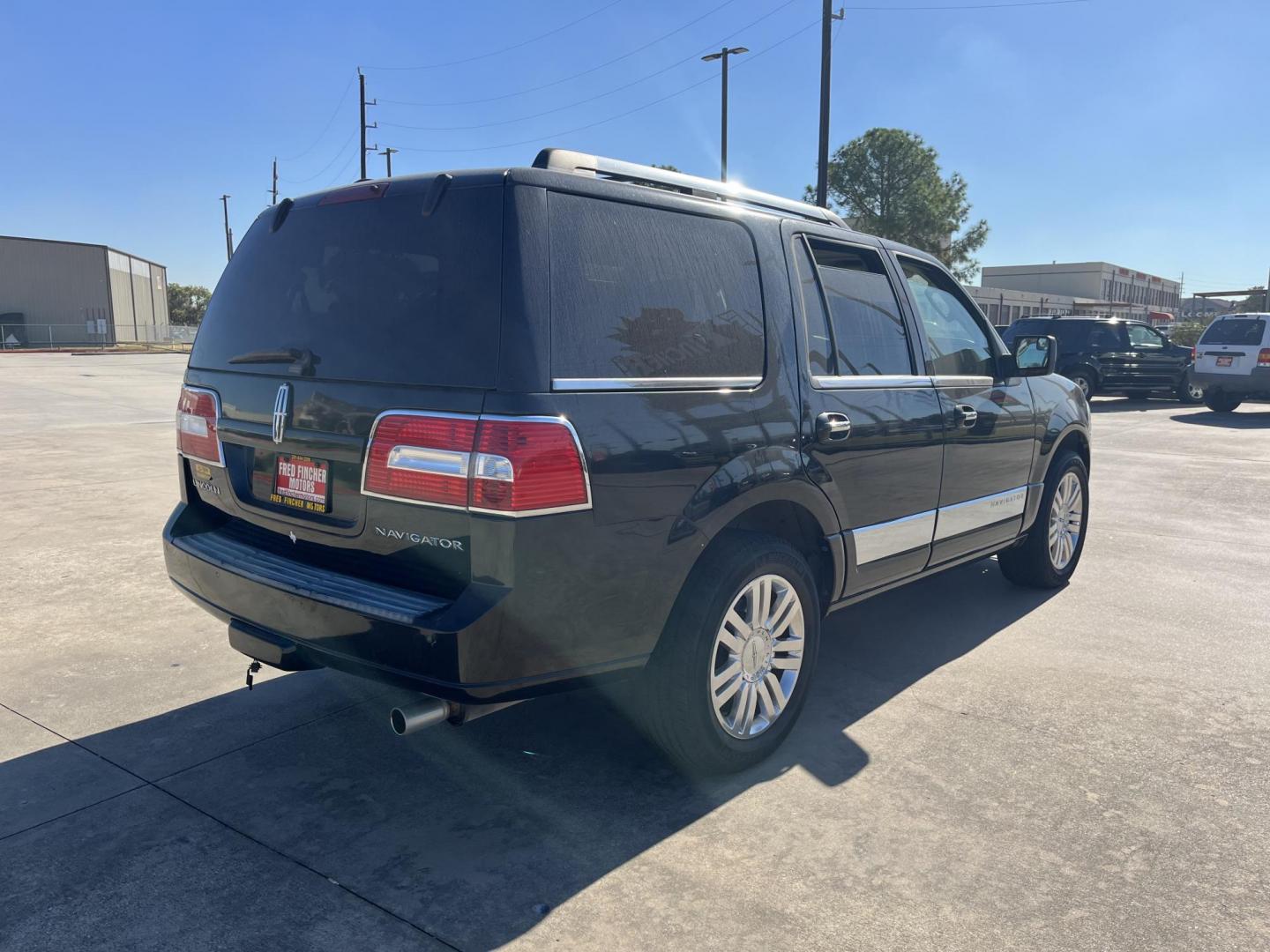 2012 black /TAN Lincoln Navigator 2WD (5LMJJ2H52CE) with an 5.4L V8 SOHC 24V engine, 6-Speed Automatic transmission, located at 14700 Tomball Parkway 249, Houston, TX, 77086, (281) 444-2200, 29.928619, -95.504074 - Photo#7