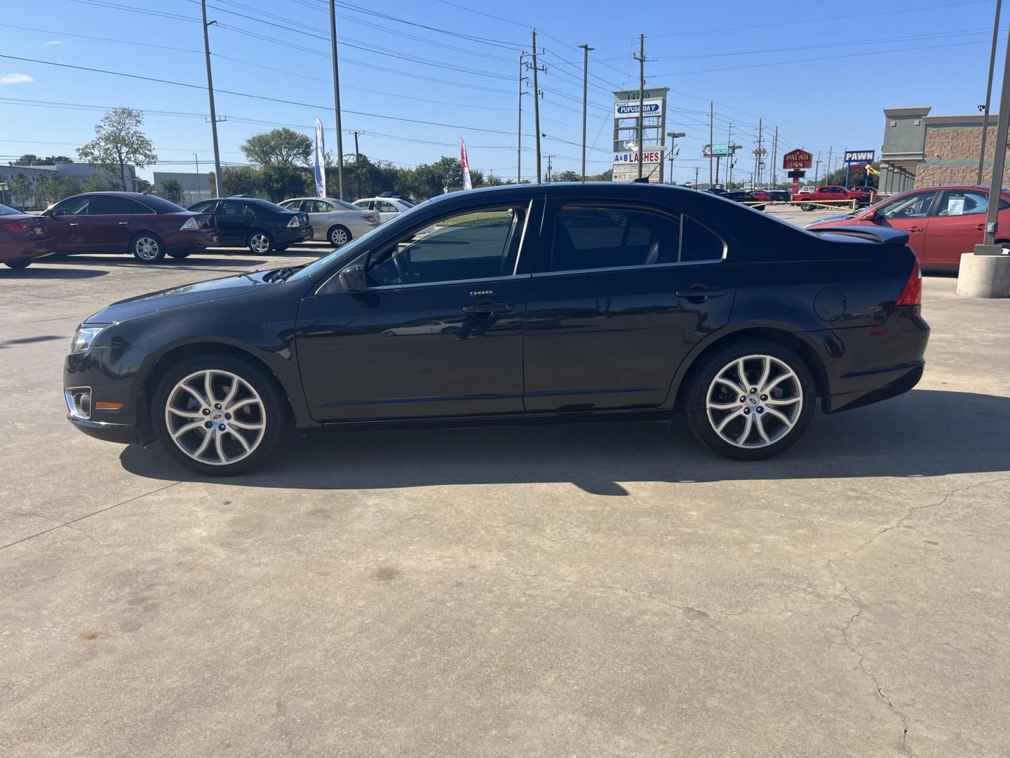 2012 Black /black Ford Fusion SEL (3FAHP0JG7CR) with an 3.0L V6 DOHC 24V engine, Automatic Overdrive transmission, located at 14700 Tomball Parkway 249, Houston, TX, 77086, (281) 444-2200, 29.928619, -95.504074 - Photo#3