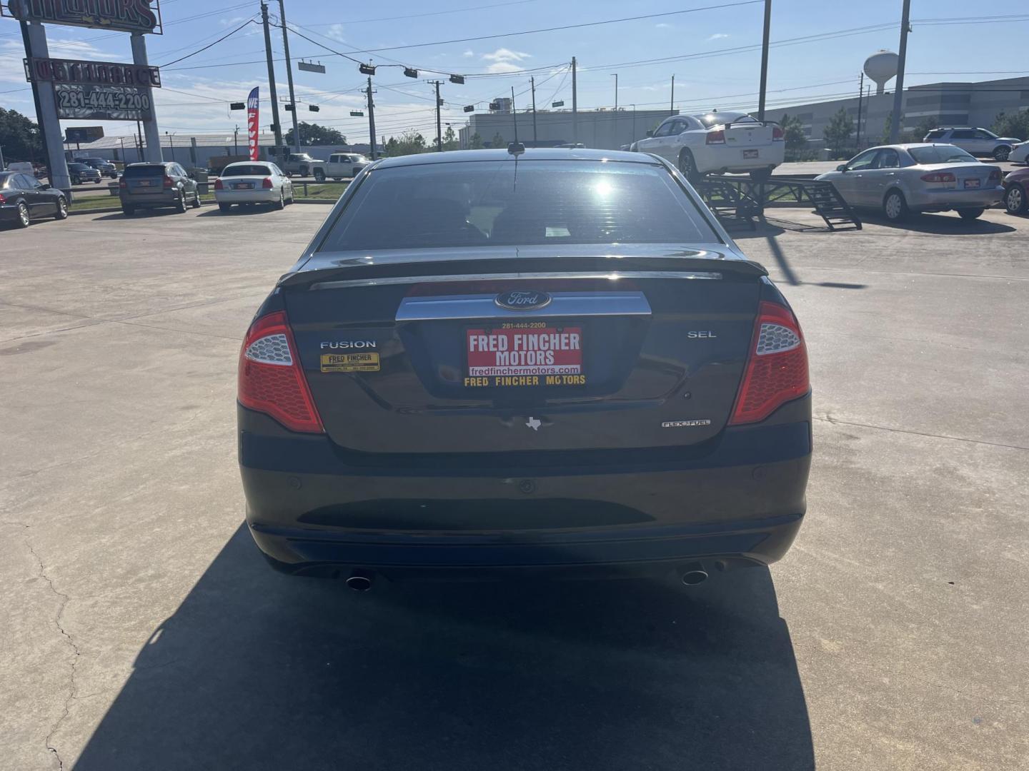 2012 Black /black Ford Fusion SEL (3FAHP0JG7CR) with an 3.0L V6 DOHC 24V engine, Automatic Overdrive transmission, located at 14700 Tomball Parkway 249, Houston, TX, 77086, (281) 444-2200, 29.928619, -95.504074 - Photo#4