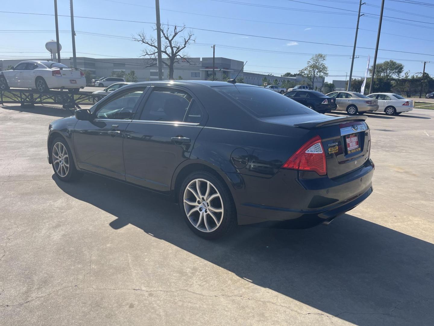 2012 Black /black Ford Fusion SEL (3FAHP0JG7CR) with an 3.0L V6 DOHC 24V engine, Automatic Overdrive transmission, located at 14700 Tomball Parkway 249, Houston, TX, 77086, (281) 444-2200, 29.928619, -95.504074 - Photo#7