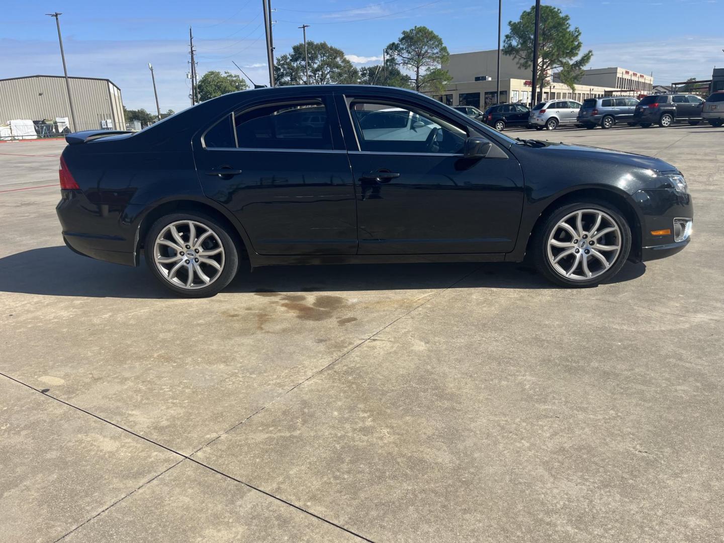 2012 Black /black Ford Fusion SEL (3FAHP0JG7CR) with an 3.0L V6 DOHC 24V engine, Automatic Overdrive transmission, located at 14700 Tomball Parkway 249, Houston, TX, 77086, (281) 444-2200, 29.928619, -95.504074 - Photo#8