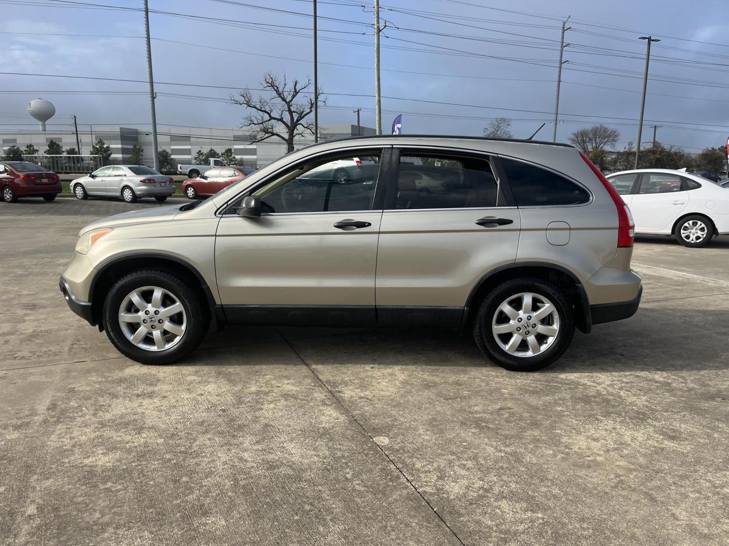 2007 GOLD /TAN Honda CR-V EX 2WD AT (JHLRE38597C) with an 2.4L L4 DOHC 16V engine, 5-Speed Automatic Overdrive transmission, located at 14700 Tomball Parkway 249, Houston, TX, 77086, (281) 444-2200, 29.928619, -95.504074 - Photo#3