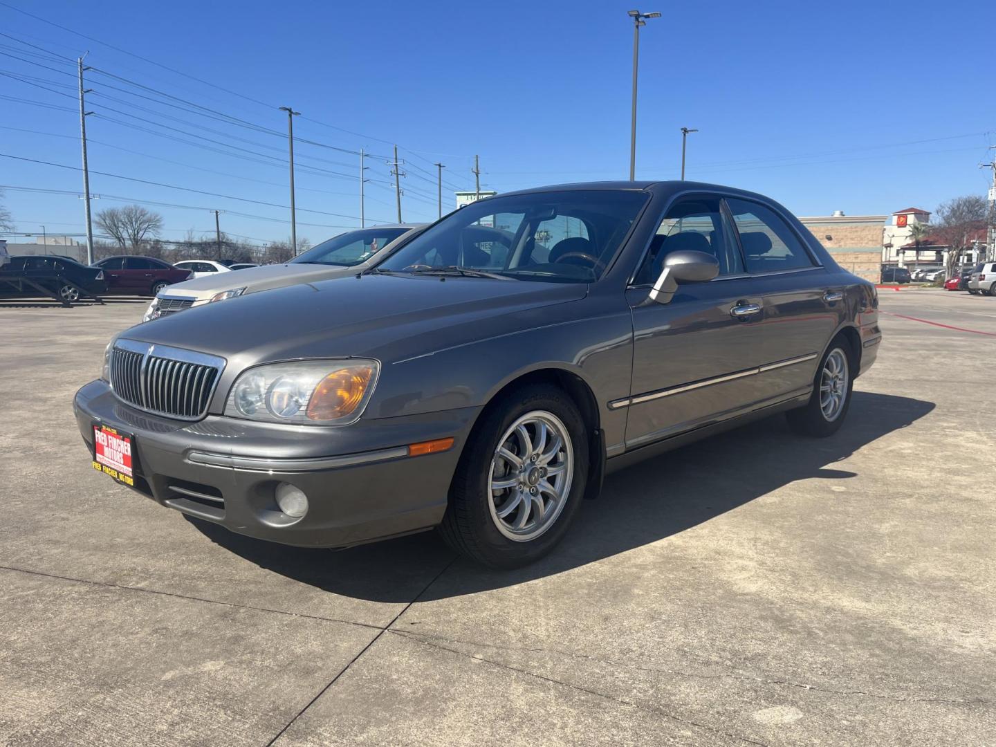 2002 green /TAN Hyundai XG350 Base (KMHFU45E52A) with an 3.5L V6 DOHC 24V engine, 5-Speed Automatic Overdrive transmission, located at 14700 Tomball Parkway 249, Houston, TX, 77086, (281) 444-2200, 29.928619, -95.504074 - Photo#2